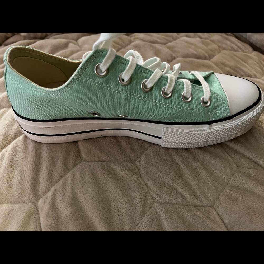 Womens All Star Converse Platform tennis shoes.